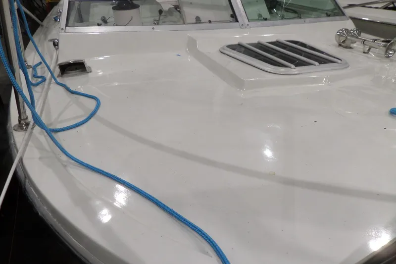 Slide: The Image of 1980 Lyman-Morse Fisherman Sleeper boat deck with blue ropes and hatch. - 42