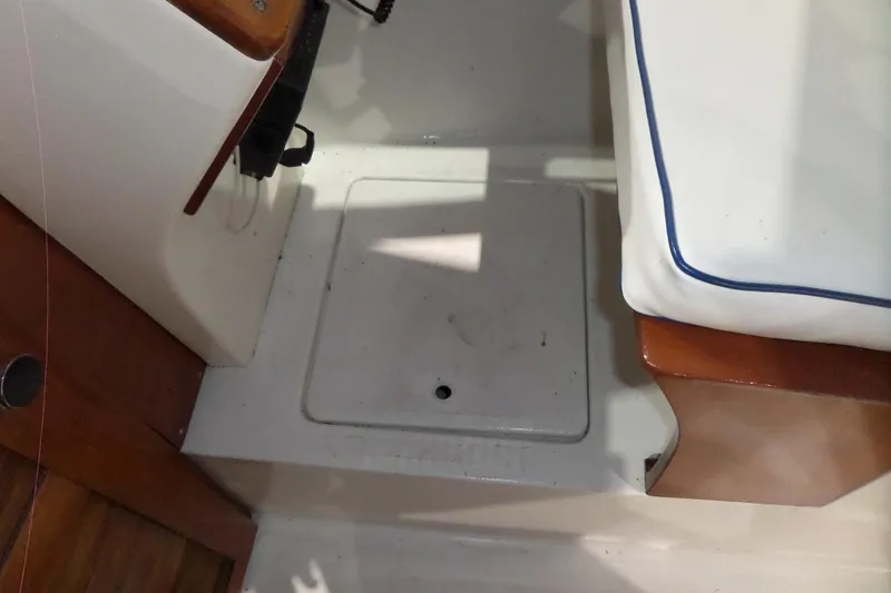 Slide: The Image of Interior view of a 1980 Lyman-Morse Fisherman Sleeper boat, featuring seating and storage. - 31