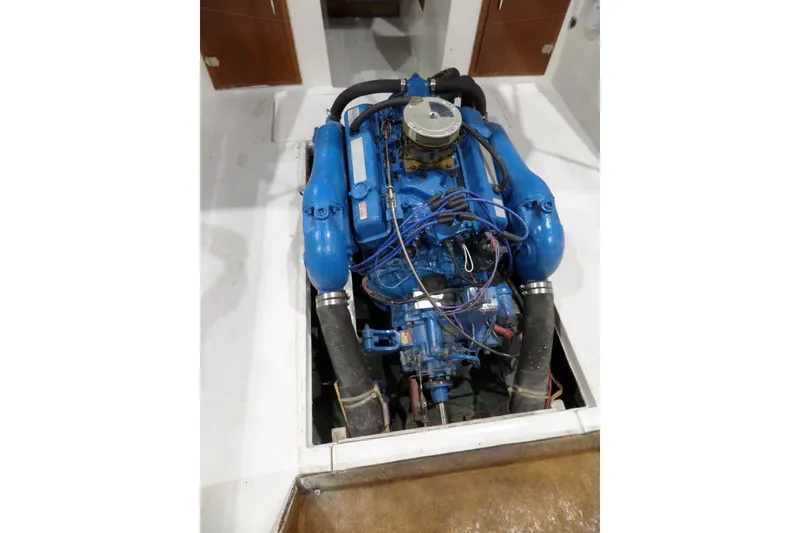 Slide: The Image of Blue engine of a 1980 Lyman-Morse Fisherman Sleeper boat, showcasing detailed components. - 33