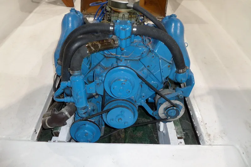 Slide: The Image of 1980 Lyman-Morse Fisherman Sleeper engine, blue, with visible belts and hoses. - 34
