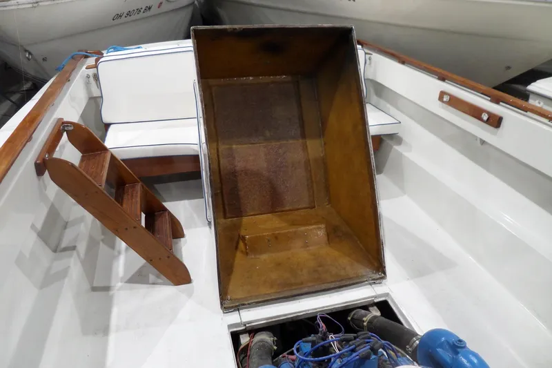 Slide: The Image of 1980 Lyman-Morse Fisherman Sleeper boat interior with wooden steps and engine compartment. - 36