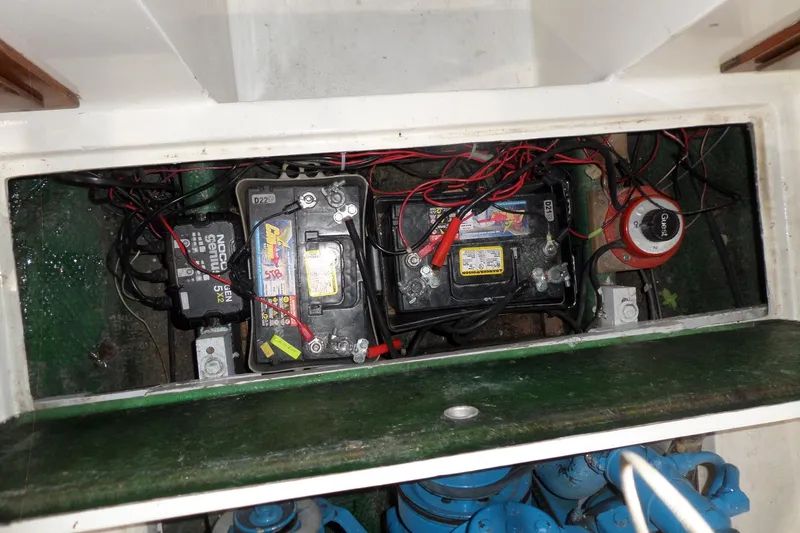 Slide: The Image of Battery compartment of a 1980 Lyman-Morse Fisherman Sleeper boat with wiring and connections. - 37
