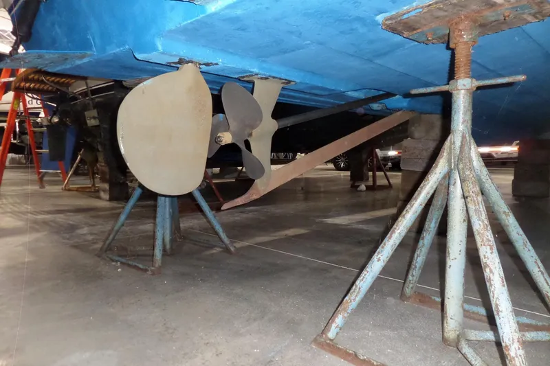 Slide: The Image of 1980 Lyman-Morse Fisherman Sleeper boat under maintenance, showing propeller and rudder. - 41