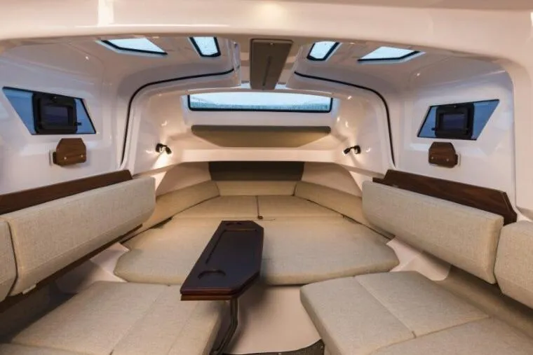 Slide: The Image of Luxurious interior of 2027 Axopar 38 Cross Cabin with modern seating and skylights. - 7