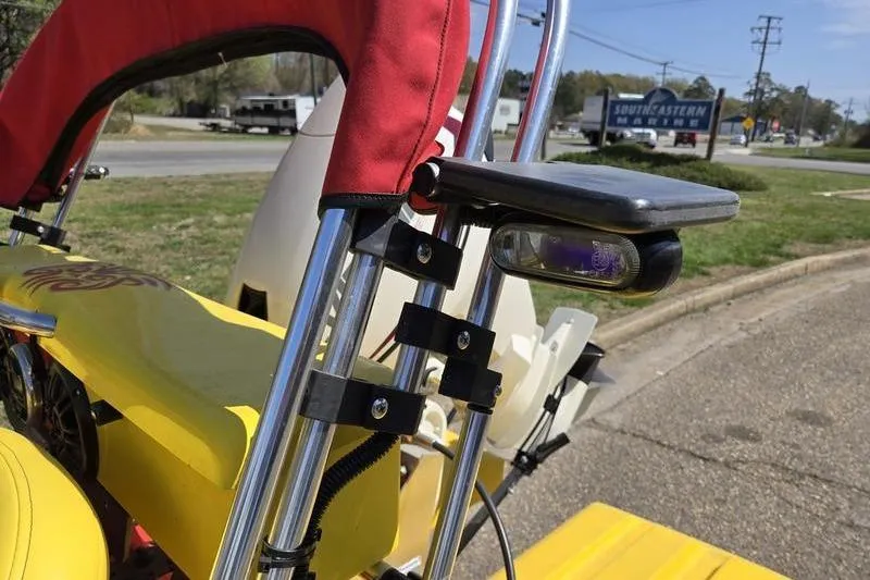 Slide: The Image of 2019 CraigCat CATCHIT with yellow body and red canopy on roadside. - 13