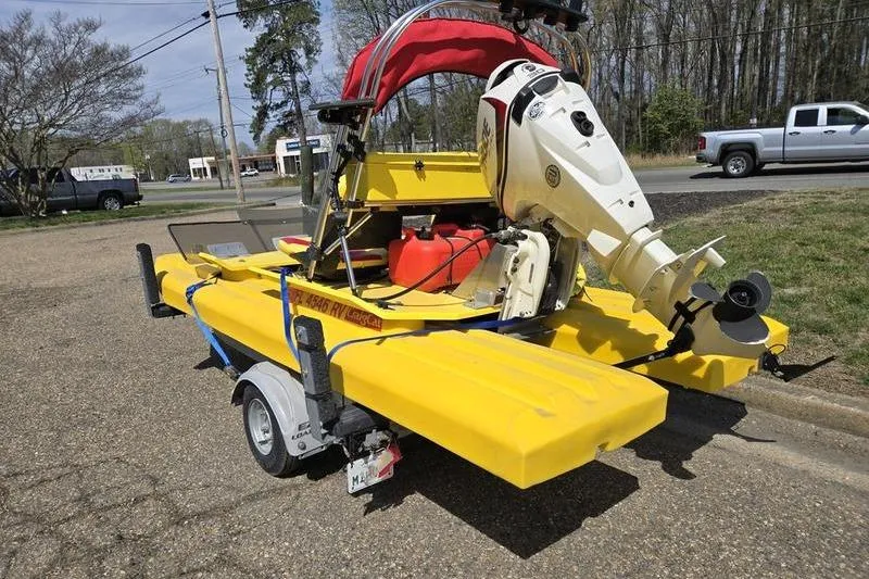 Slide: The Image of Yellow 2019 CraigCat CATCHIT boat on trailer with outboard motor. - 3