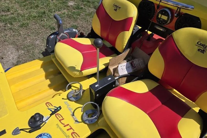 Slide: The Image of Yellow and red 2019 CraigCat CATCHIT seats with control panel and cup holders. - 4