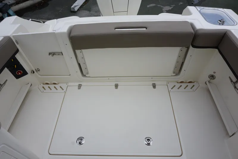 Slide: The Image of Boston Whaler 240 Vantage 2026 boat interior with seating and storage compartments. - 11