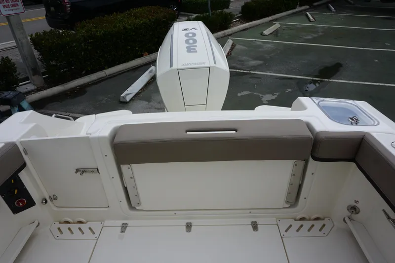 Slide: The Image of 2026 Boston Whaler 240 Vantage boat interior with seating and engine view. - 12
