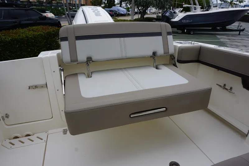 Slide: The Image of 2026 Boston Whaler 240 Vantage boat interior with foldable seating and sleek design. - 13