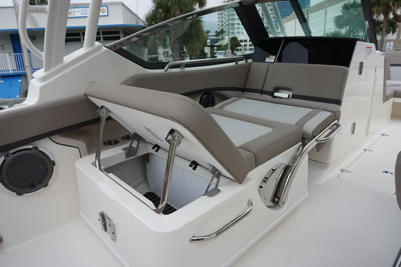 Slide: The Image of 2026 Boston Whaler 240 Vantage boat interior with open storage compartment and seating. - 18