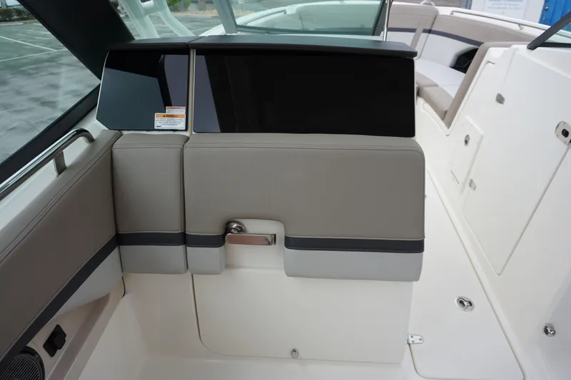 Slide: The Image of 2026 Boston Whaler 240 Vantage interior seating and console detail. - 26