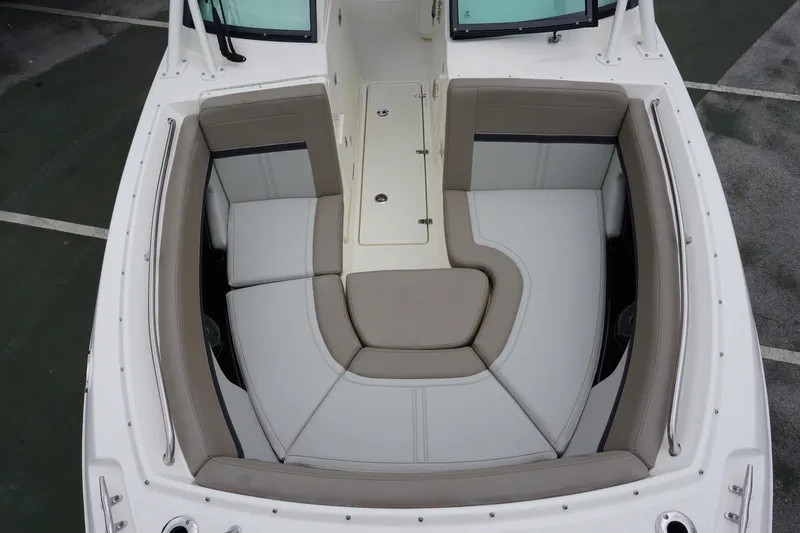 Slide: The Image of 2026 Boston Whaler 240 Vantage boat interior with cushioned seating and storage compartments. - 31
