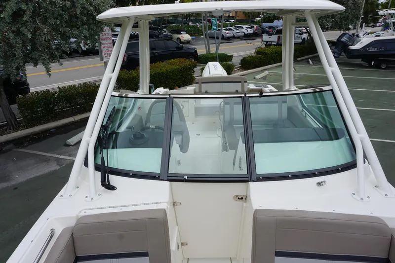 Slide: The Image of 2026 Boston Whaler 240 Vantage boat, parked, showcasing sleek design and spacious seating. - 33