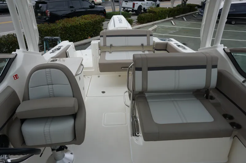 Slide: The Image of 2026 Boston Whaler 240 Vantage boat interior with seating and helm. - 37