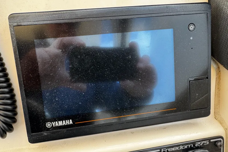 Slide: The Image of Yamaha display on 2019 Grady-White Freedom 275 boat dashboard. - 17