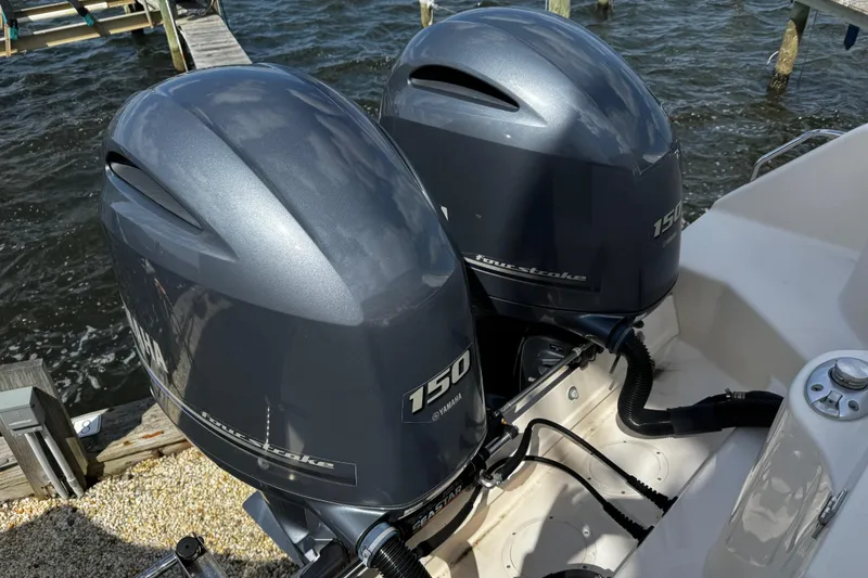 Slide: The Image of Twin Yamaha 150 horsepower outboard engines on a 2019 Grady-White Freedom 275 boat. - 21
