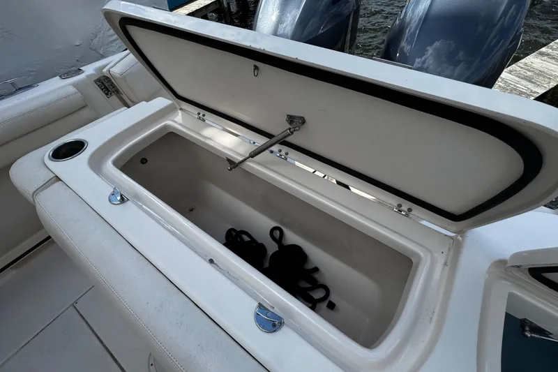 Slide: The Image of Grady-White Freedom 275 boat, open storage compartment, year 2019. - 25