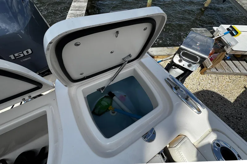 Slide: The Image of Grady-White Freedom 275 boat with open storage compartment, 2019 model. - 26