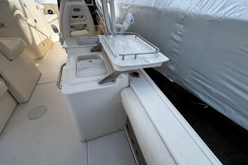 Slide: The Image of 2019 Grady-White Freedom 275 boat interior with seating and storage compartments. - 28