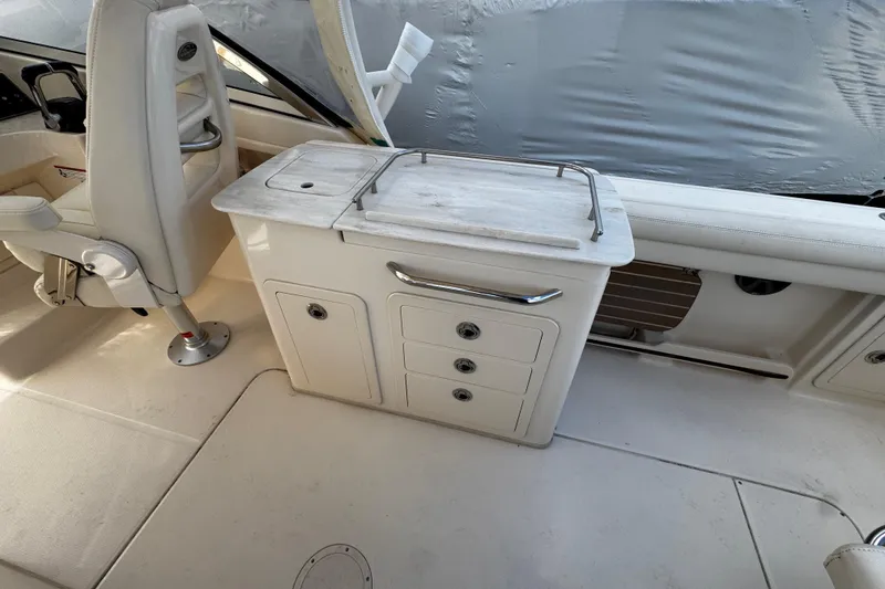 Slide: The Image of 2019 Grady-White Freedom 275 boat interior with seating and storage compartments. - 31