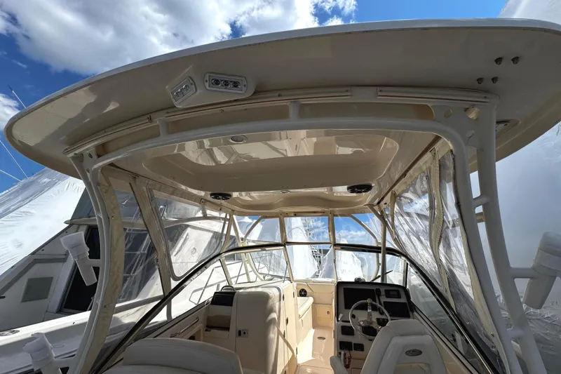 Slide: The Image of Interior view of a 2019 Grady-White Freedom 275 boat under blue sky. - 32