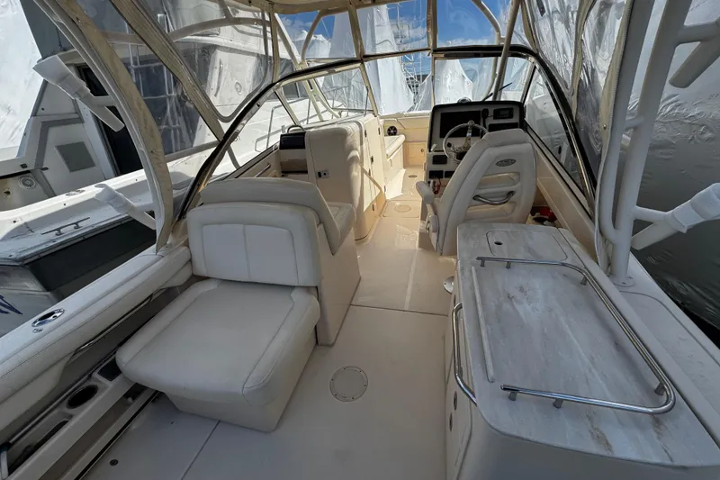 Slide: The Image of 2019 Grady-White Freedom 275 boat interior with seating and helm station. - 33