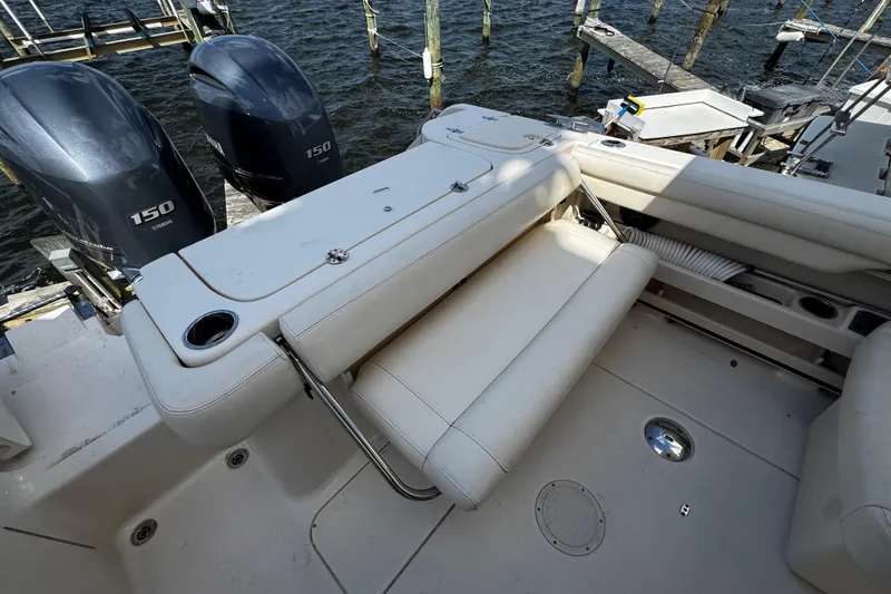 Slide: The Image of 2019 Grady-White Freedom 275 boat with dual Yamaha 150 engines and comfortable seating. - 35