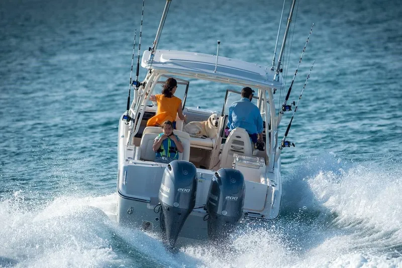 Slide: The Image of Manufacturer Provided Image: 2019 Grady-White Freedom 275 boat cruising on the water with passengers. - 4