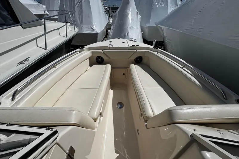 Slide: The Image of 2019 Grady-White Freedom 275 boat interior with beige seating and sleek design. - 51