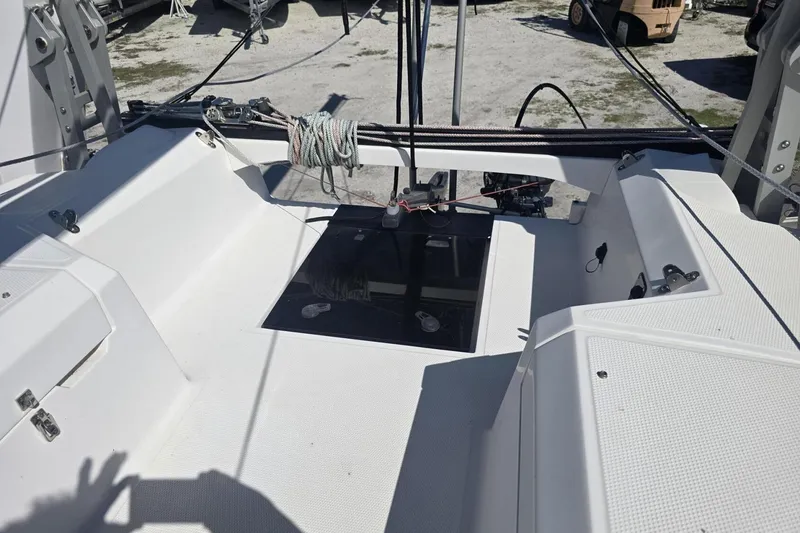 Slide: The Image of Cockpit of 2021 Corsair 880 Sport sailboat with ropes and hatch. - 7