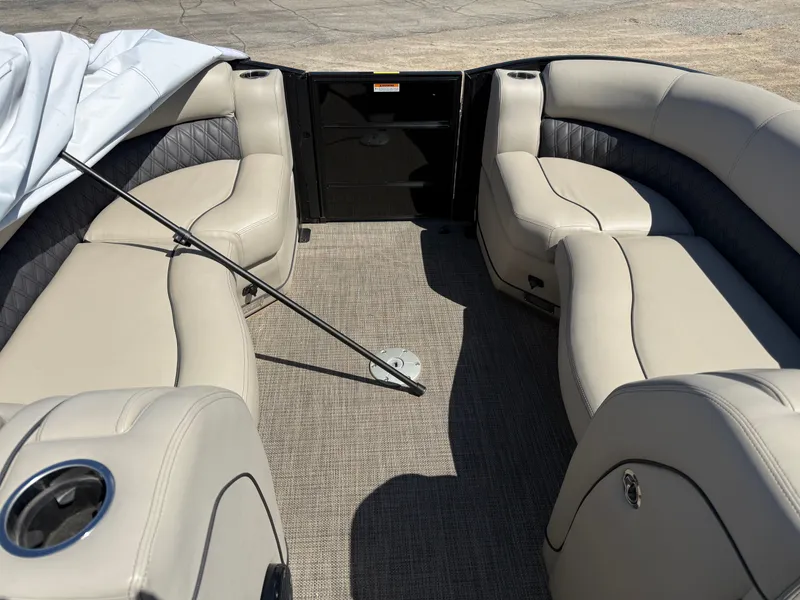 Slide: The Image of Interior of a 2019 Barletta Lusso 23UC pontoon boat with beige seating. - 3