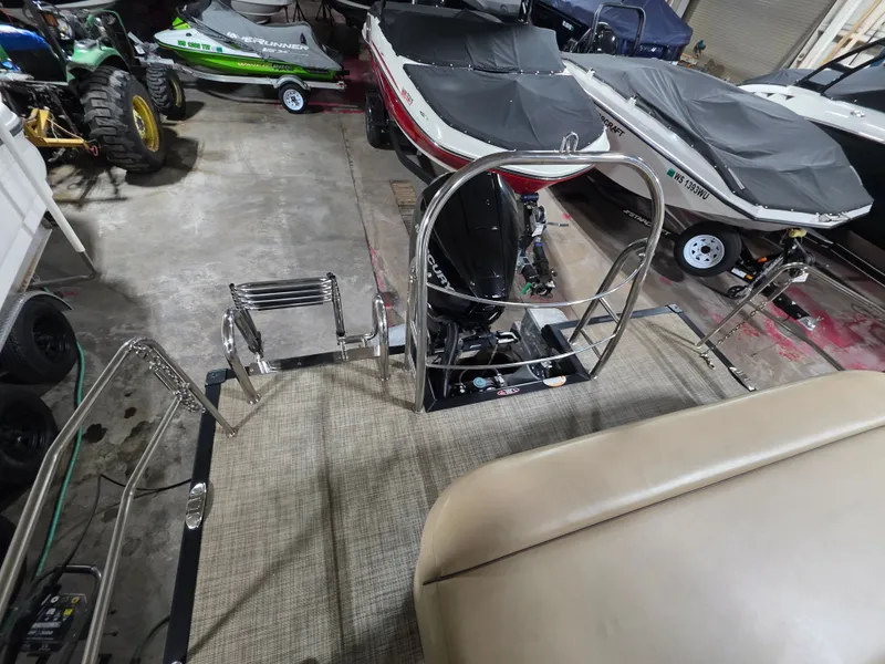 Slide: The Image of 2019 Harris 250 CR pontoon boat in storage facility. - 12