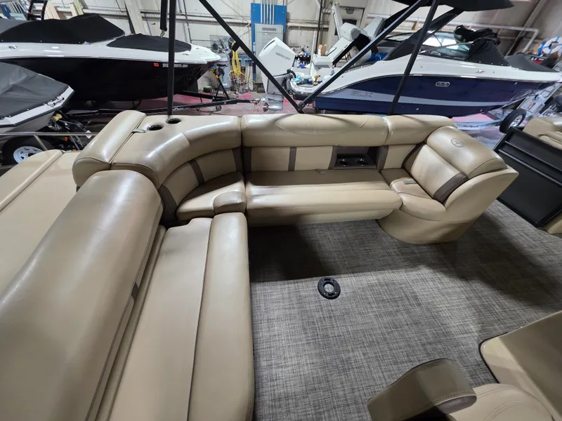 Slide: The Image of Interior of a 2019 Harris 250 CR boat with beige leather seating. - 13