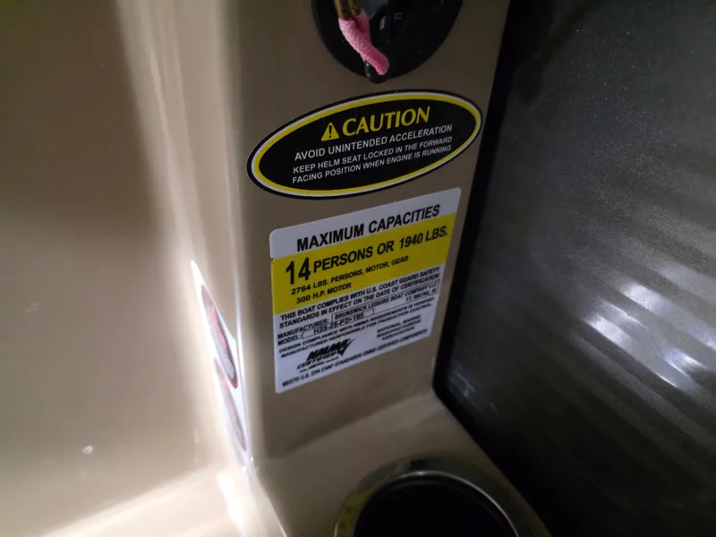 Slide: The Image of Warning label on a Harris 250 CR boat, maximum capacity 14 persons. - 17