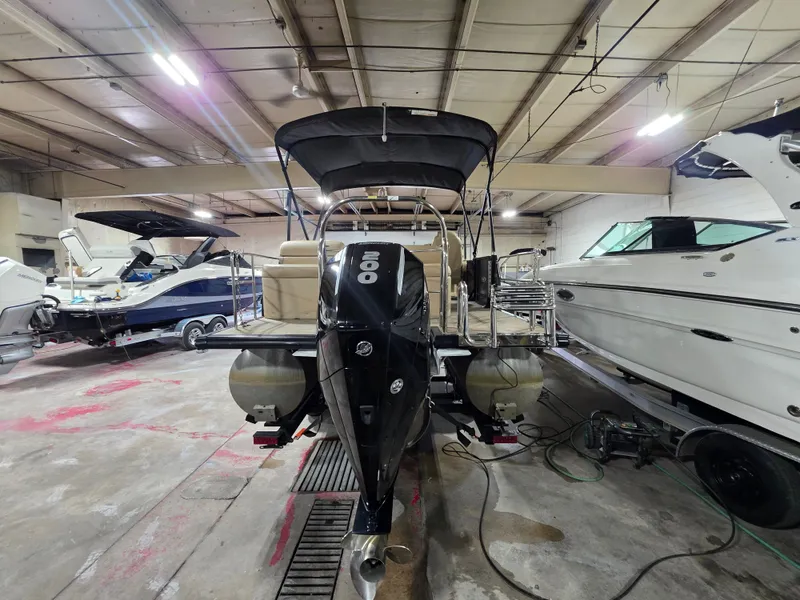 Slide: The Image of 2019 Harris 250 CR pontoon boat in warehouse with outboard motor. - 3