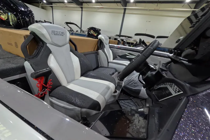 Slide: The Image of 2026 Skeeter boat interior with sleek seats and modern steering wheel design. - 11