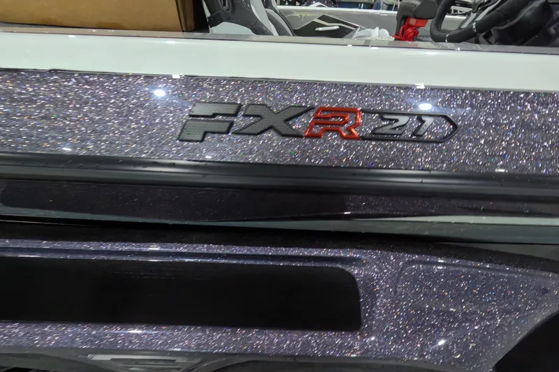 Slide: The Image of 2026 Skeeter FXR21 boat with glittery finish and bold red logo. - 13