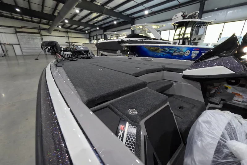 Slide: The Image of 2026 Skeeter boat interior in a showroom, featuring spacious deck and modern design. - 5