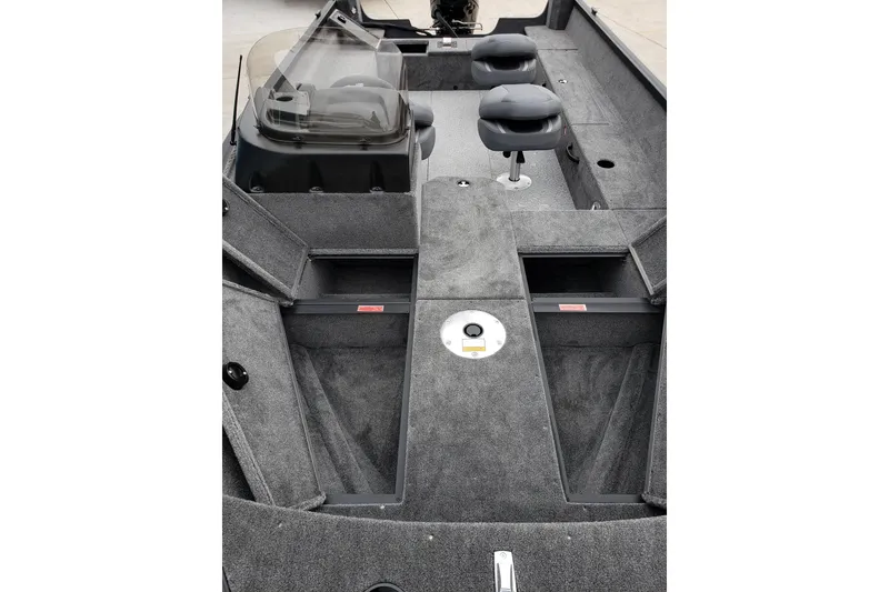 Slide: The Image of 2026 Alumacraft Voyageur 175 SC boat interior with seating and storage compartments. - 10