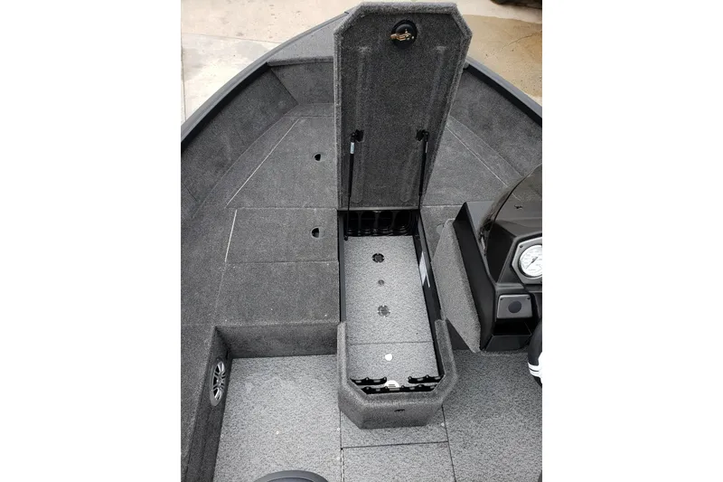 Slide: The Image of 2026 Alumacraft Voyageur 175 SC boat interior with open storage compartment. - 13
