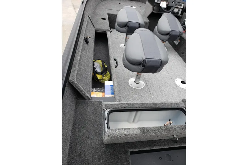 Slide: The Image of 2026 Alumacraft Voyageur 175 SC boat interior with seating and storage compartments. - 9
