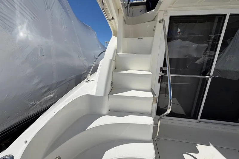 Slide: The Image of Staircase on 2007 Sea Ray 36 Sedan Bridge yacht with sleek white design. - 10