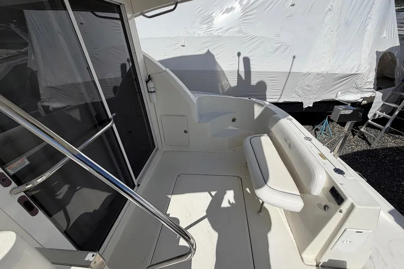 Slide: The Image of 2007 Sea Ray 36 Sedan Bridge boat deck with seating and railing. - 11