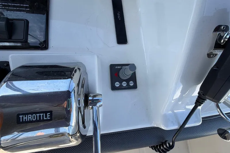 Slide: The Image of Throttle and control panel of a 2007 Sea Ray 36 Sedan Bridge boat. - 17