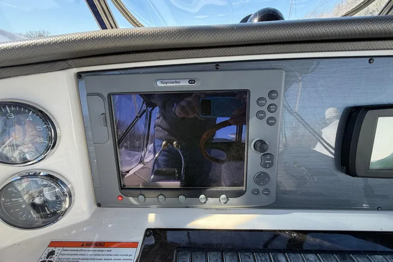 Slide: The Image of Control panel of a 2007 Sea Ray 36 Sedan Bridge with Raymarine display. - 18