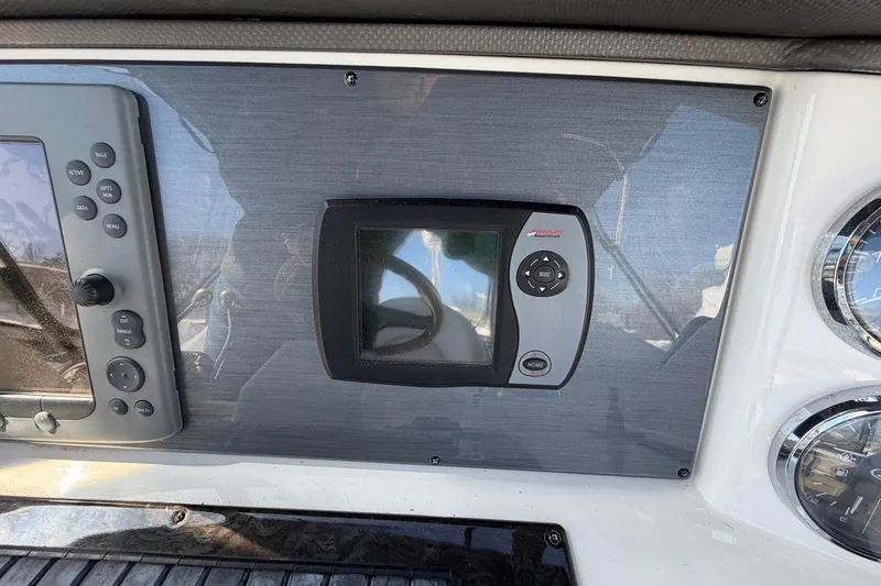 Slide: The Image of 2007 Sea Ray 36 Sedan Bridge dashboard with navigation controls and display. - 19