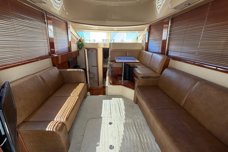 Slide: The Image of Luxurious interior of a 2007 Sea Ray 36 Sedan Bridge yacht with leather seating. - 20