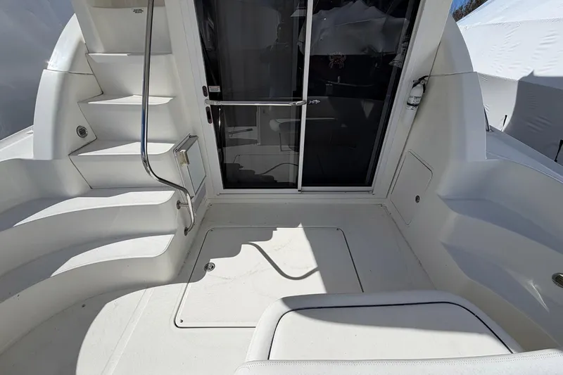 Slide: The Image of 2007 Sea Ray 36 Sedan Bridge yacht deck with stairs and sliding door. - 6