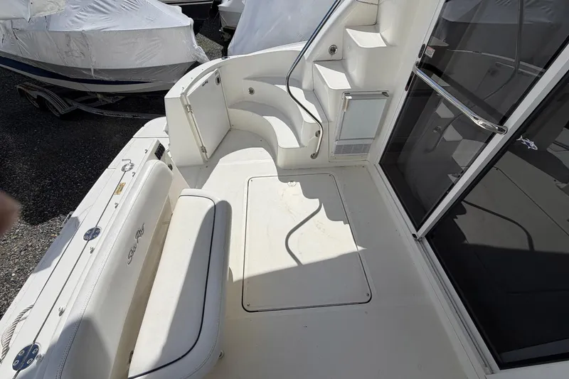Slide: The Image of 2007 Sea Ray 36 Sedan Bridge boat deck with seating and stairs. - 8